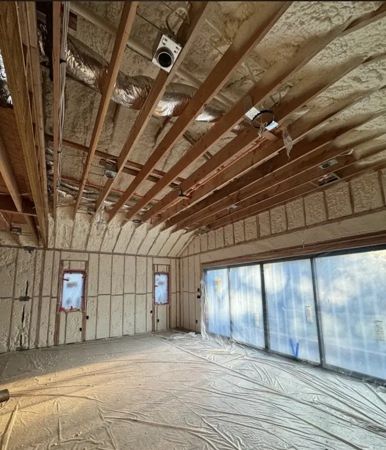 Interior walls and ceiling insulated with spray foam during new construction in Handy